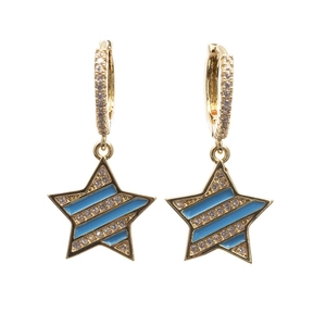 Gold star earrings with blue enamel and clear cubic zirconia on white background