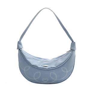 Light blue crescent moon shoulder bag with decorative white stitching and heart charm