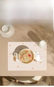 Close-up of extra large disposable placemat for kids with cute cat patterns and table set