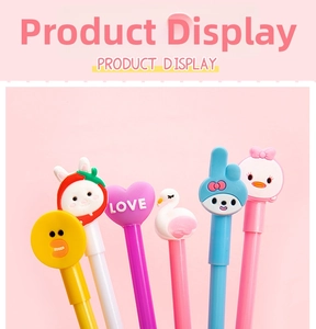 Detail shot of cartoon gel pens featuring cute chick, bunny, and heart silicone charms