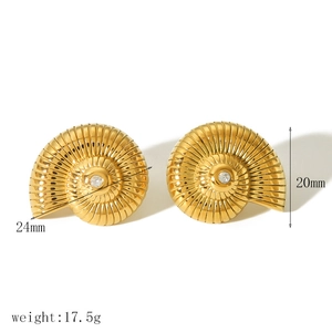 Detailed view of 18k gold plated spiral conch earrings with sparkling center crystals
