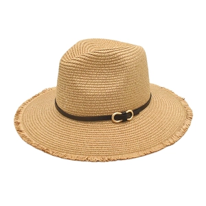 Detail of straw sun hat featuring fringed edges and a leather band with gold metal buckle