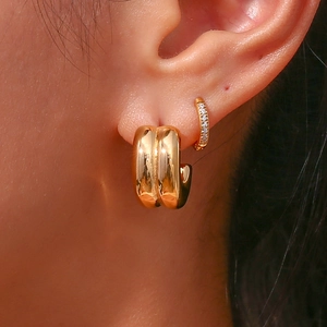 Chic double-layer C-shape gold earrings featuring polished and crystal-set bands