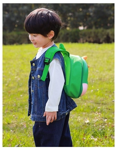 Detail of adjustable breathable mesh straps on green dinosaur backpack for toddlers