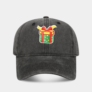 Close-up of green gift box embroidery on vintage washed black baseball cap