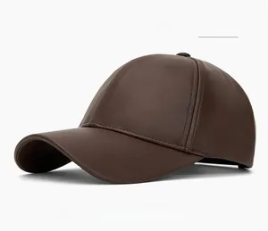 Detailed view of the dark coffee PU leather baseball cap featuring fine grain texture
