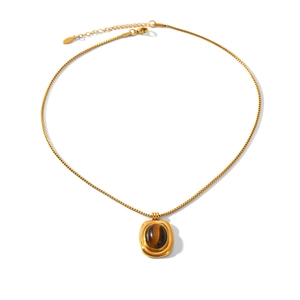 Detail of vintage stainless steel necklace with brown tiger eye stone oval pendant