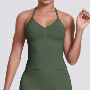 Detailed close-up of dark green V-neck sports vest with central ruched knitting detail