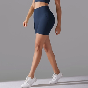 Detail of high waisted navy blue seamless yoga shorts with tummy control compression