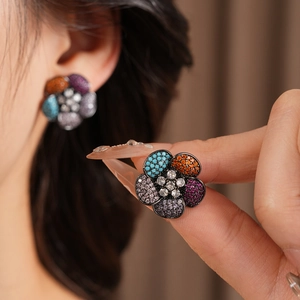Detailed close-up of vintage floral earrings featuring vibrant multi-colored zircon stones