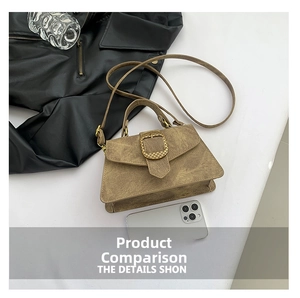 Detailed view of a brown vintage leather handbag with a textured gold square buckle