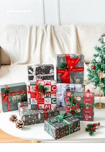 Detailed close-up of festive Christmas wrapping paper with deer prints and matching ribbons