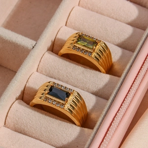 18K gold plated stainless steel rings with green and black rectangular zircons in a box