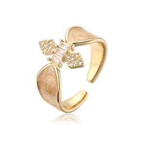 Detail of 18K gold-plated open ring with champagne enamel and sparkling zircon stars