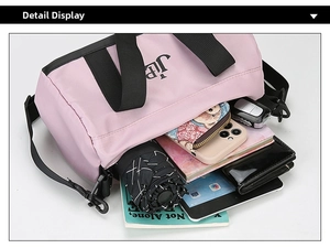 Pink nylon pillow bag showing large capacity with umbrella, phone, and tablet storage
