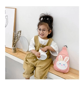 Pink rabbit canvas chest bag shown on a child model with a minimalist background