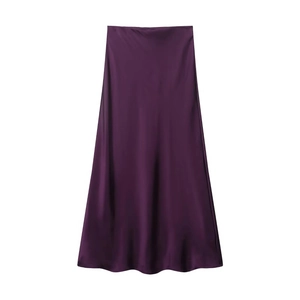 Detailed view of dark purple satin midi skirt fabric with silky texture and drape