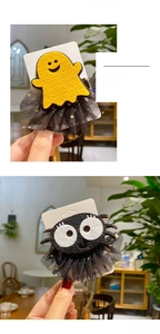 Detail of Halloween hair clips with mesh and felt ghost and spider designs for cosplay