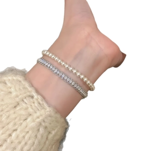 Elegant double-layered silver snake chain bracelet with white pearls and sparkling zircons