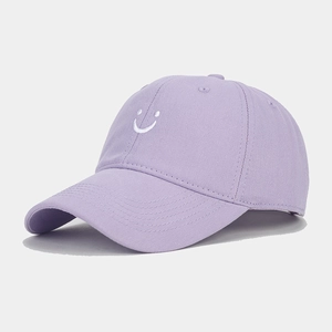 Close-up of a light purple baseball cap featuring high-density cotton and white smile embroidery