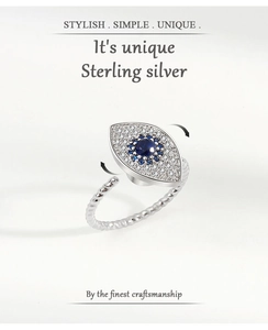 Detail of S925 sterling silver spinning ring with blue evil eye and rotating design