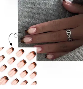 Short square press-on nails with brown tortoiseshell patterns on gray knit fabric
