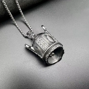 Macro detail of vintage silver Viking Odin bell pendant with intricate Nordic engravings