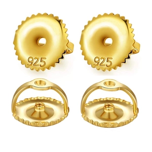 Detailed macro view of 925 sterling silver earring backs in gold finish with hallmarks