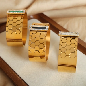 Gold plated honeycomb bangles with rectangular gemstones in green black and white