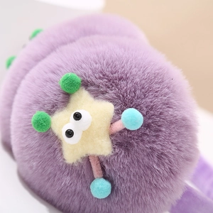 Detailed close-up of soft purple plush earmuffs featuring a cute yellow star character