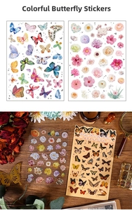 Macro detail of vintage butterfly and floral stickers on a rustic wooden desk with accessories