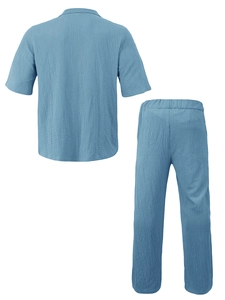 Detailed view of blue seersucker fabric texture on men's casual shirt and pants set