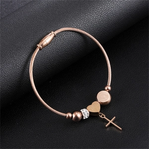 Rose gold stainless steel twisted wire bracelet with heart and cross charms on leather