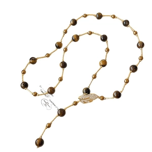 Bohemian tiger eye beaded necklace with a sparkling gold zircon leaf pendant detail