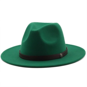 Close-up of emerald green wool felt jazz hat with dark leather band and metal buckle