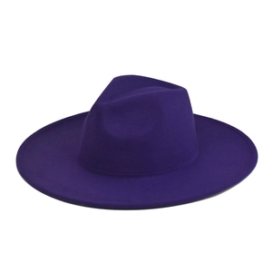 Close-up of deep purple wool felt fedora showing fine stitching on the wide flat brim