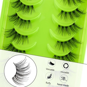 Macro detail of 5 pairs of handmade fluffy 3D cluster eyelashes on green tray