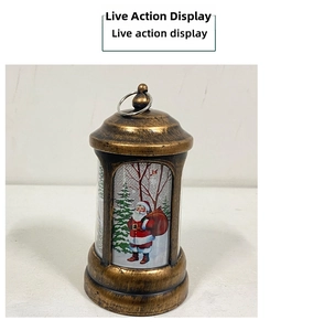 Detail of vintage bronze Christmas lantern featuring Santa Claus and hanging ring