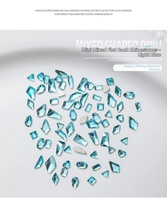 Flatback light blue nail art crystals in various geometric shapes shown from top view