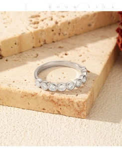 Macro view of S925 silver ring featuring seven bezel-set moissanite stones on stone base
