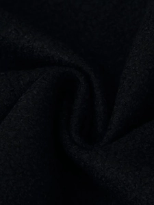 Close-up of premium black wool fabric texture with thick绒 sense for women's winter coat