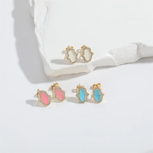 Golden Hamsa Hand stud earrings with colorful enamel and zircon inlay on white stone