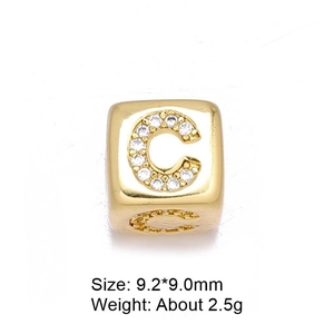 Macro view of 8mm gold letter C bead with micro-pave cubic zirconia for DIY jewelry