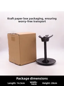 Detalle de portavelas vintage de hierro fundido con pájaro y su caja de embalaje kraft
