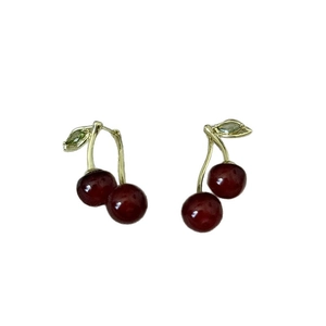 Elegant cherry earrings with red resin beads and green stones on a gold stem
