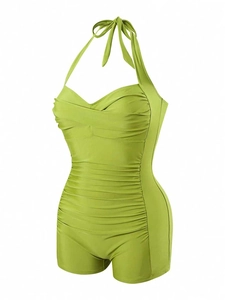 Detail of teal lace-up one-piece swimsuit featuring ruched tummy control and sweetheart neck