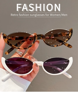 Detail of trendy oval cat eye sunglasses in tortoiseshell and white frames with CE marking