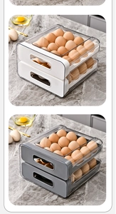 Detail view of drawer-style double-layer egg storage box in white and grey colors