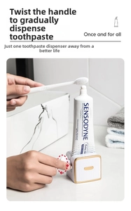 Manual toothpaste squeezer with gold dial shown in a bathroom scene detail