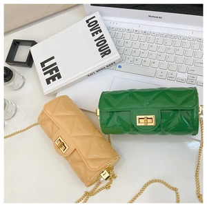 Chic quilted cylindrical mini bags in beige and green with gold chain and pearl accents